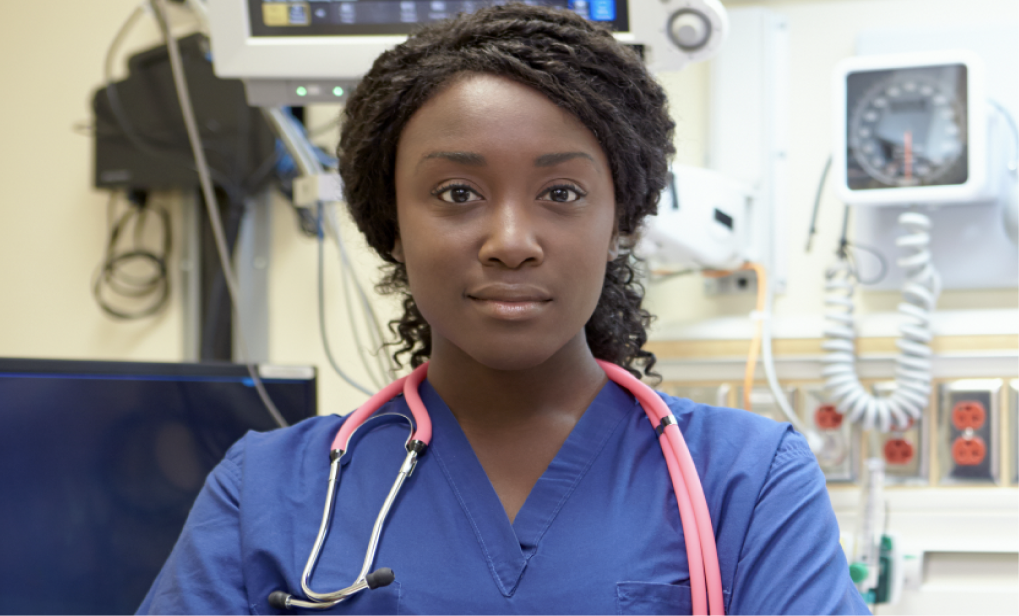 Woman standing in her neighborhood and smiling